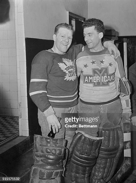 Goalie Alfie Moore , of the New York Americans, congratulates Goalie Broda, of the Toronto Maple Leafs, in the dressing room at Madison Square...