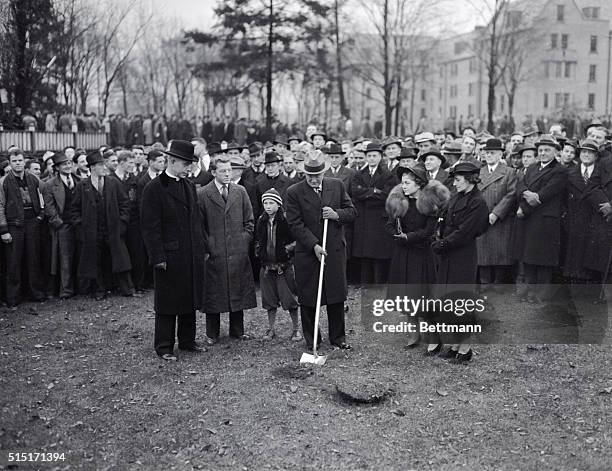 The scene on Notre Dame's campus near South Bend, Indiana, is seen here, as the ground was broken for the Rockne Memorial Field House, to be erected...