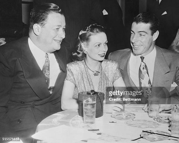 Toots Shor and Mrs. Shor with Joe DiMaggio , New York Yankees outfielder, at recent supper party in Wedgwood Room of Waldorf-Astoria.
