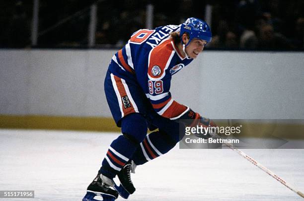 Wayne Gretzky, of the Edmonton Oilers, controls the puck during a game at Nassau Coliseum on Long Island in New York.