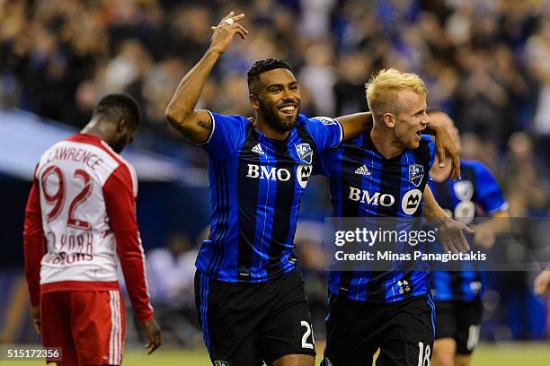 Anthony Jackso-Hamel of the Montreal Impact celebrates his second half goal with teammate Kyle Bekker during the MLS game against the New York Red...