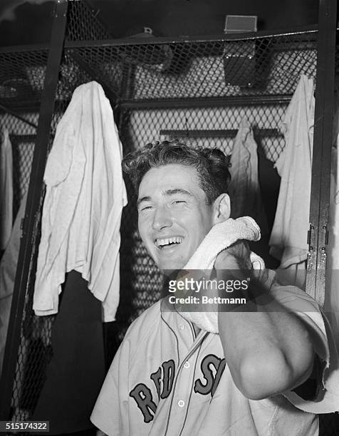 Flashing a big smile in the locker room after yesterday's All Star Game is Ted Williams of the Boston Red Sox League, the leading batter who broke up...