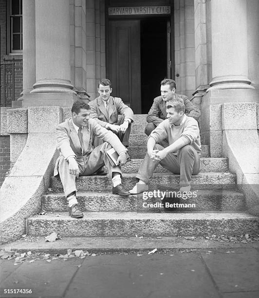 Members of the Harvard football team are shown relaxing outside the Varsity Club. Front, left to right: John Florentino, Everett, Massachusetts, end;...