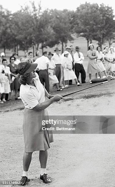 Tulsa, Okla.: Mrs. George Zaharias, Denver, Colo., blasts out of trap as she defeated Maureen Orcutt during match in Women's National Amateur Golf...