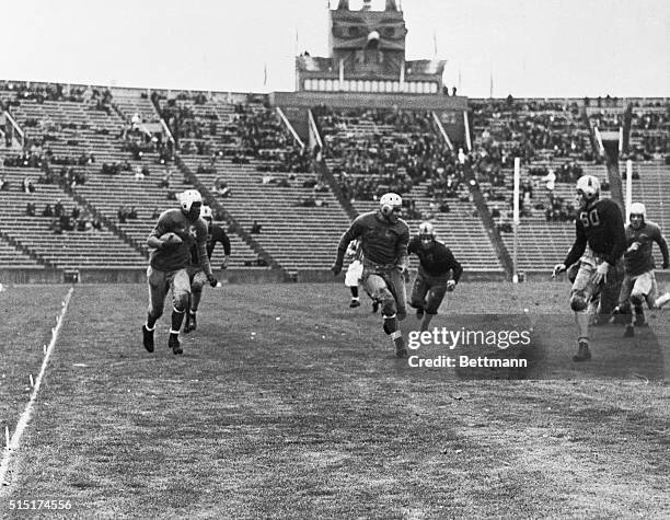 John Robinson UCLA's brilliant sophomore halfback is seen here reeling off a 63-yard punt return during the game in which the Bruins defeated the...