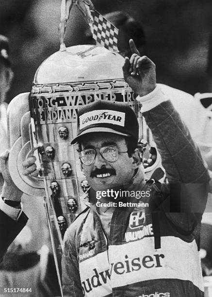 Speedway, Ind.: Bobby Rahal grins and puts his finger in the air 5/31 in victory circle after taking first place in the Indianapolis 500. Rahal, of...