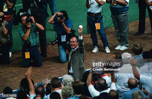 Houston, Texas: U.S. Vice President George Bush waves to the fans in the Astrodome prior to throwing out the first ball at the 57th All-Star game.