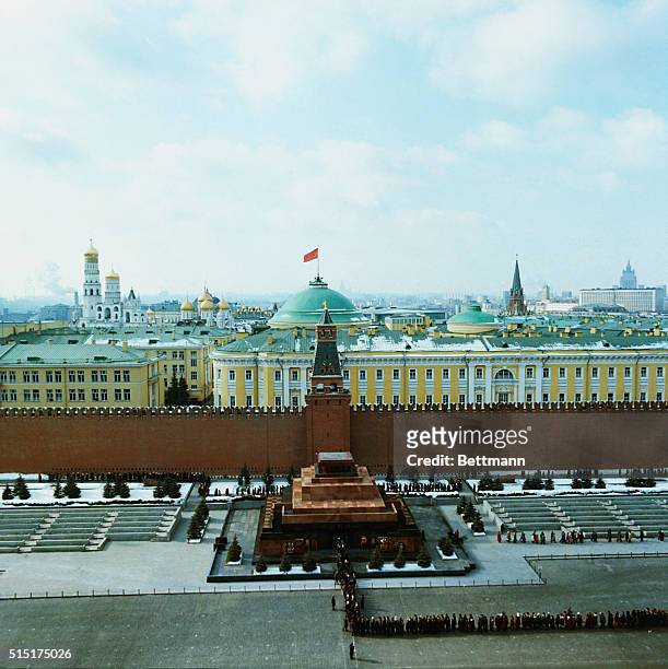 Aerial view of the line of people waiting to see the preserved corpse of Vladimir Ilyich Lenin in the Mausoleum of Red Square. In the background, the...