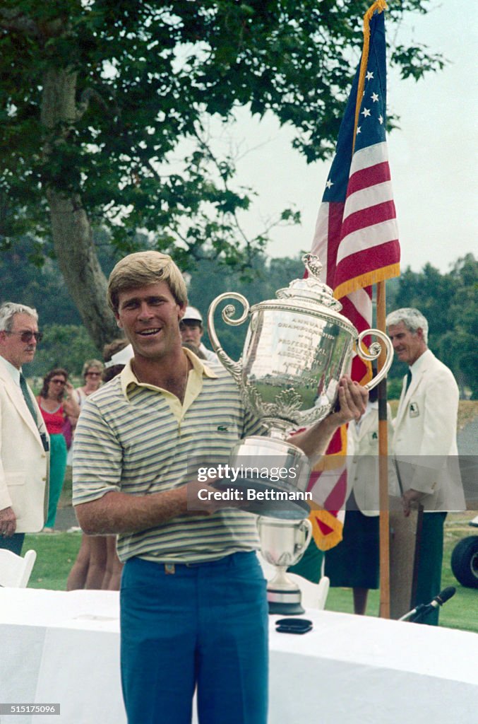 Golf Professional Hal Sutton Holding His Trophy