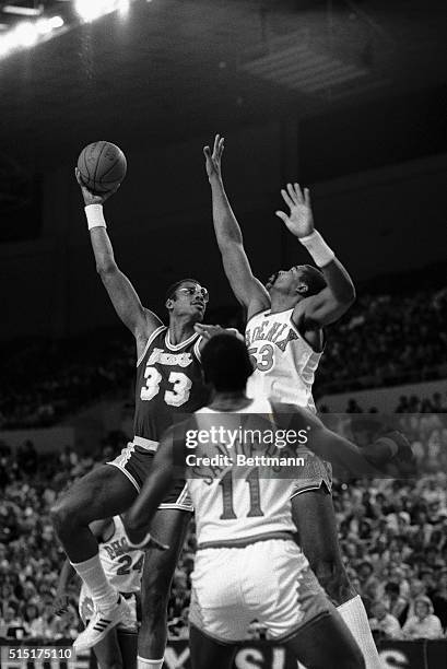 Phoenix, AZ- Los Angeles Lakers' center, Kareem Abdul-Jabbar, goes up for a skyhook shot with the Phoenix Suns', James Edwards, in 1st period action.