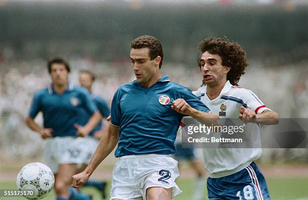Mexico City: France's Dominique Rocheteau challenges Italy's Giuseppe Bergomi during the first half of the second round World Cup match at Olympic...