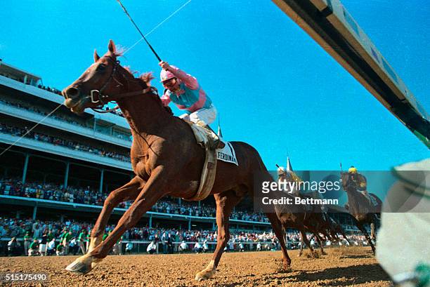 Willie Shoemaker rides Ferdinand to victory in the 112th Kentucky Derby. It was Shoemaker's 4th Derby win.