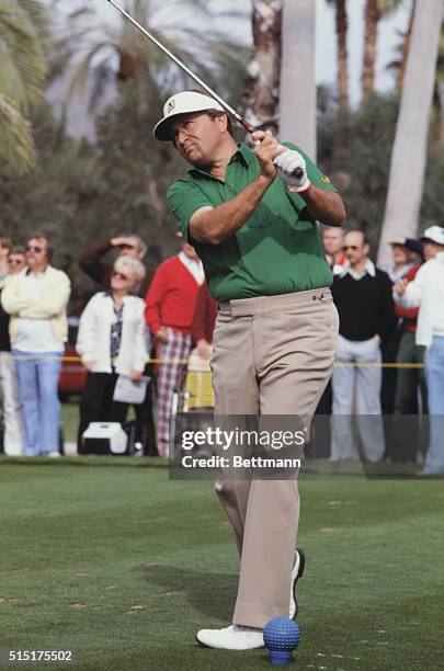 Palm Springs, California: Golfer Ray Floyd watches the golf ball after finishing his wing during the Bob Hope Classic Golf Tournament.