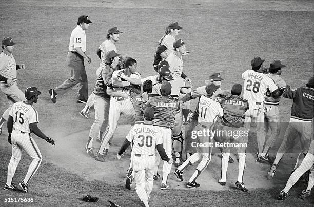 New York: Mets' Darryl Strawberry is held back from getting at Braves' pitcher David Palmer after Palmer had hit him with a pitch in the 1st inning...