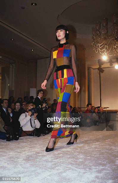 Fashion model wears a bright geometric dress design for Bill Blass' Spring collection show.