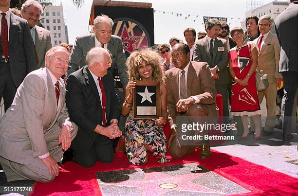 Hollywood, California: Grammy award winner recording star Tina Turner smiles as she poses for photographers on the "Hollywood Walk of Fame". Turner...