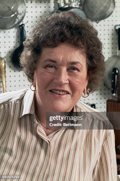 Santa Barbara, Calif.: Julia Child takes time out to pose for a picture in her small, functional Santa Barbara kitchen. Child says "any kitchen is...