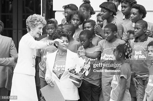 Washington, DC- Nancy Reagan greets local youngsters who are members of the "Just Say No" club at the White House 6/22. The slogan urges youngsters...