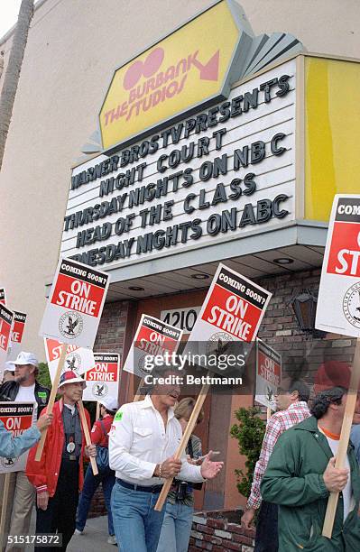 Burbank, Calif.: Actor-director Ricardo Montalban speaks to fellow demonstrators as the Directors Guild of America walk an informational picket line...