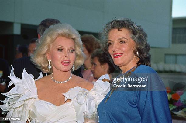 Beverly Hills, Calif.: Zsa Zsa Gabor and Jane Russell are pictured shortly before Gabor was given one of the City of Hope's Diamond Jubilee...