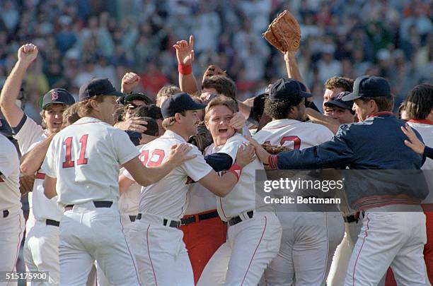 Boston: Toronto Blue Jays. Red Sox players celebrate on the field after they defeated the Toronto Blue Jays 12-3 to clinch the American League East...