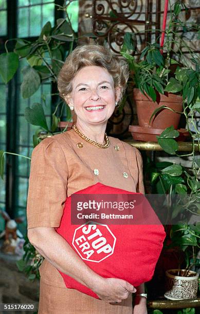Alton, Ill.: Phyllis Schlafly, seen at home holding a pillow saying "STOP ERA," credited with singlehandedly killing the Equal Rights Amendment....