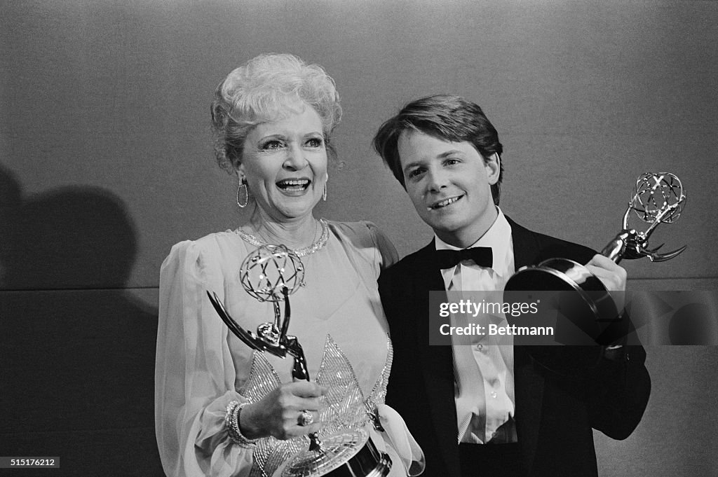 Betty White and Michael J. Fox Holding Emmy Awards