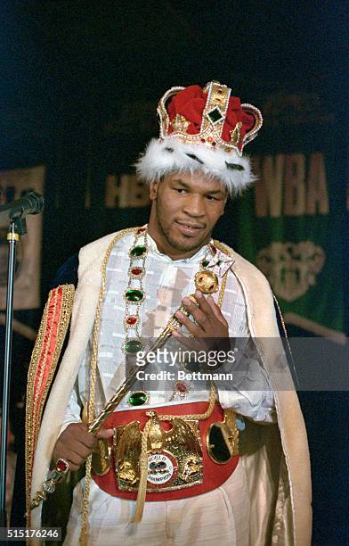 World Heavyweight Champion Mike Tyson, wearing a crown and chinchilla robe provided by Don King, after winning against IBF champion Tony Tucker.