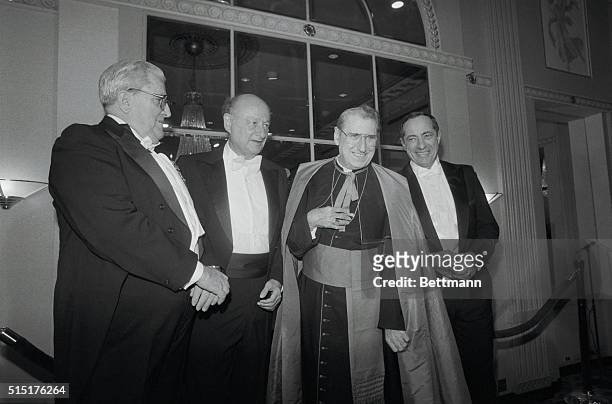 New York, N.Y.: Cardinal John O'Connor poses with keynote speaker Vernon Walters, Edward Koch, and Mario Cuomo during Alfred E. Smith Catholic...