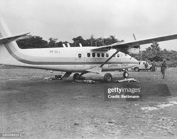 Bodies lie on the Port Kaituma airstrip by the plane which was to carry them back to Georgetown. Congressman Leo Ryan and four other Americans were...