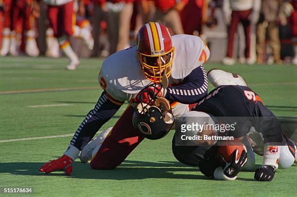 Chicago: Washington Redskins' Dexter Manley sacks Bears' Jim McMahon knocking his helmet off in the first quarter at Soldier Field January 10th.