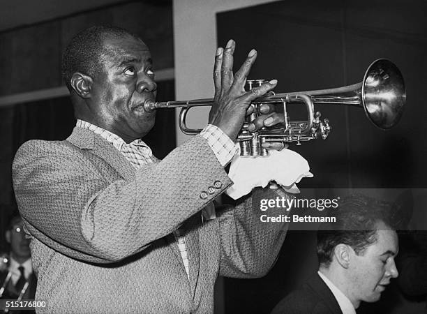 London, England: Louis Armstrong , playing at Royal Festival Hall, London. Photo, Dec.17, 1956.