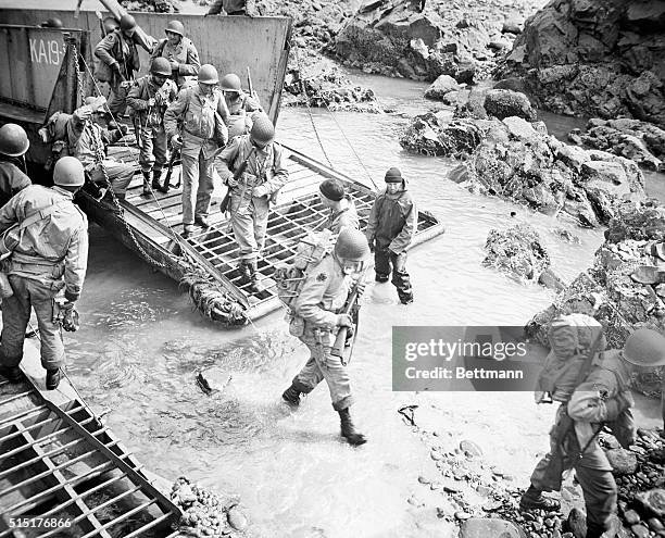 World War II amphibious landing operation. U.S. Marines leaving landing craft. Undated photograph.