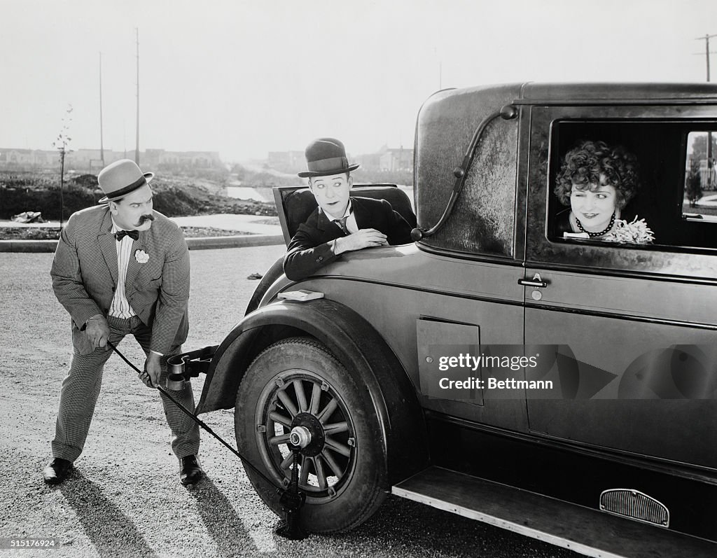 Movie Still;Changing Tire,Using Jack