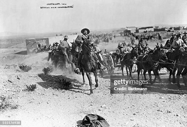 Pancho Villa Galloping along his column. Photograph 1914. BPA2# 4144