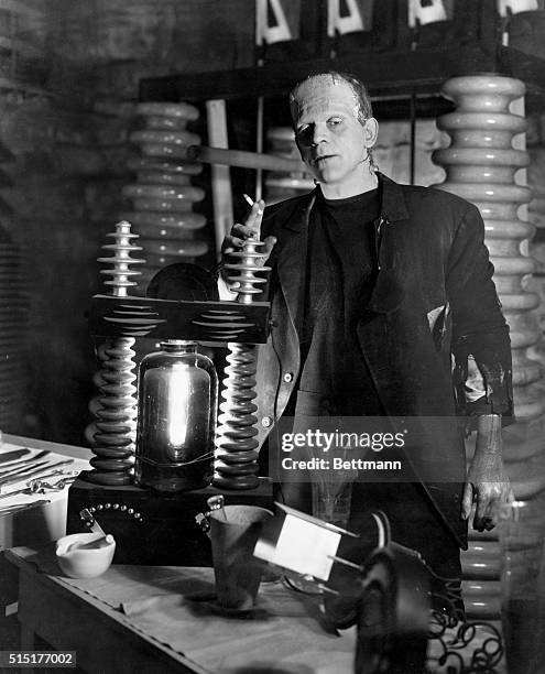 Boris Karloff as the monster in the laboratory. Scene from "Frankenstein." Movie still.