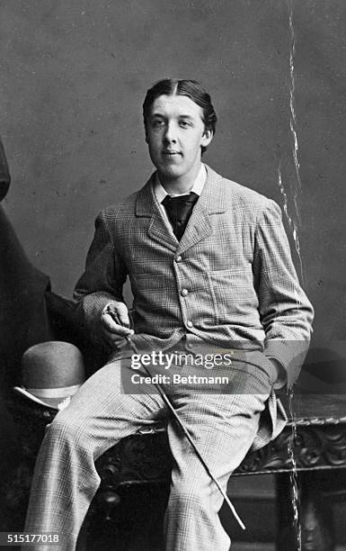 Oscar Wilde Irish writer and wit. Photograph, June 2, 1875. Seated portrait. Hills & Saunders, Ruoby & Oxford. Also at Cambridge Eton Haprow London...