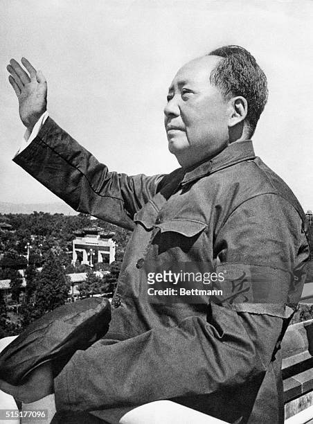 Peking, China: Mao Tse-Tung, Chairman of the Chinese Communist Party, wears a "Red Guard" armband as he waves to a rally celebrating the Cultural...