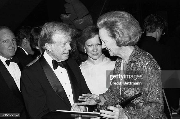 New York: Former President and Mrs. Jimmy Carter chat with Katharine Graham, Chairman of the Washington Post Company, during gala celebration in...