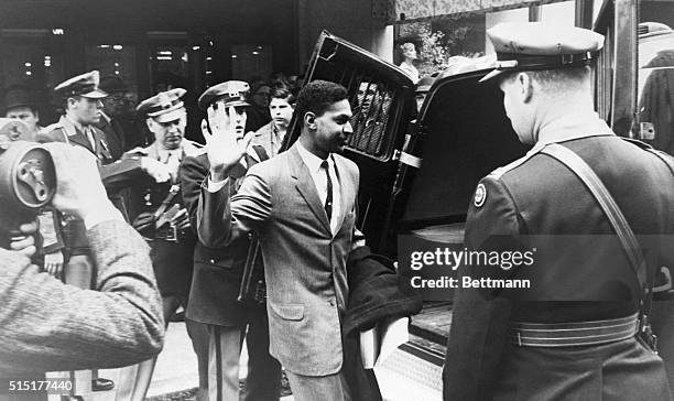 One of more than 35 protesters arrested at a sit-in at the segregated lunch counter in Thalhimer's is led away by police to a patrol wagon. They were...