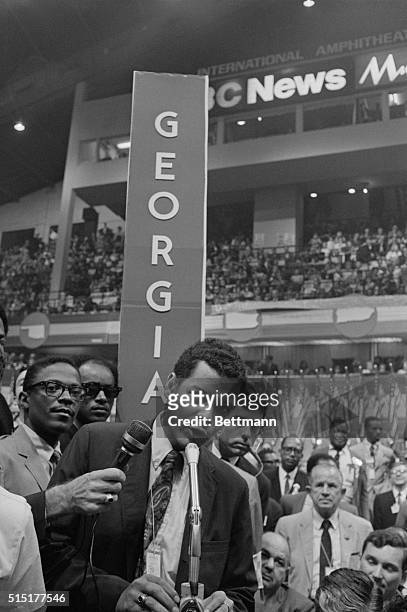 Chicago, IL: Georgia delegate Julian Bond is at the microphone on the floor of the Convention Hall, after his name was placed in nomination for the...