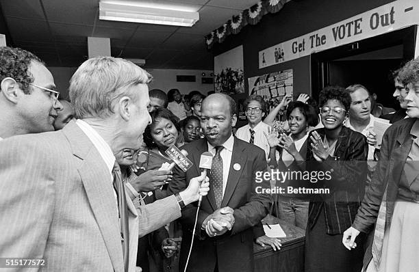 Atlanta, GA: City Councilman John Lewis clasps his hands as he is surrounded by happy campaign supporters while he talks to the press after an...