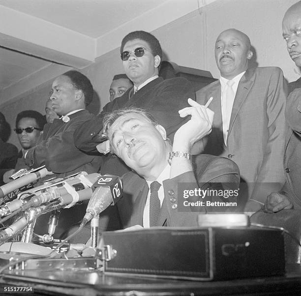 New York, NY: Former Congressman Adam Clayton Powell confronts the press here March 24. Powell predicted March 24 a "civil war" in America this...