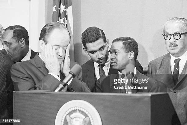 Washington, D.C.: Tension shows on the faces of Vice President Humphrey and Walter E. Fauntroy , member of the Washington city council, as they wait...