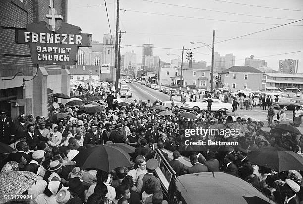 Atlanta, Georgia: Hundreds braved a heavy rain 4/8 afternoon outside the Ebenezer Baptist Church as the body of Dr. Martin Luther King was brought...