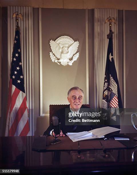 Washington, D.C.: Portrait of Franklin D. Roosevelt seated at desk -- the last color image of him before the announcement of his death.