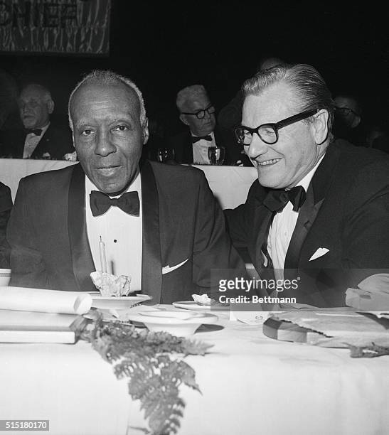 New York, NY: Governor Nelson Rockefeller chats with A. Phillip Randolph, labor and civil rights leader, during a dinner at the Waldorf Astoria Hotel...