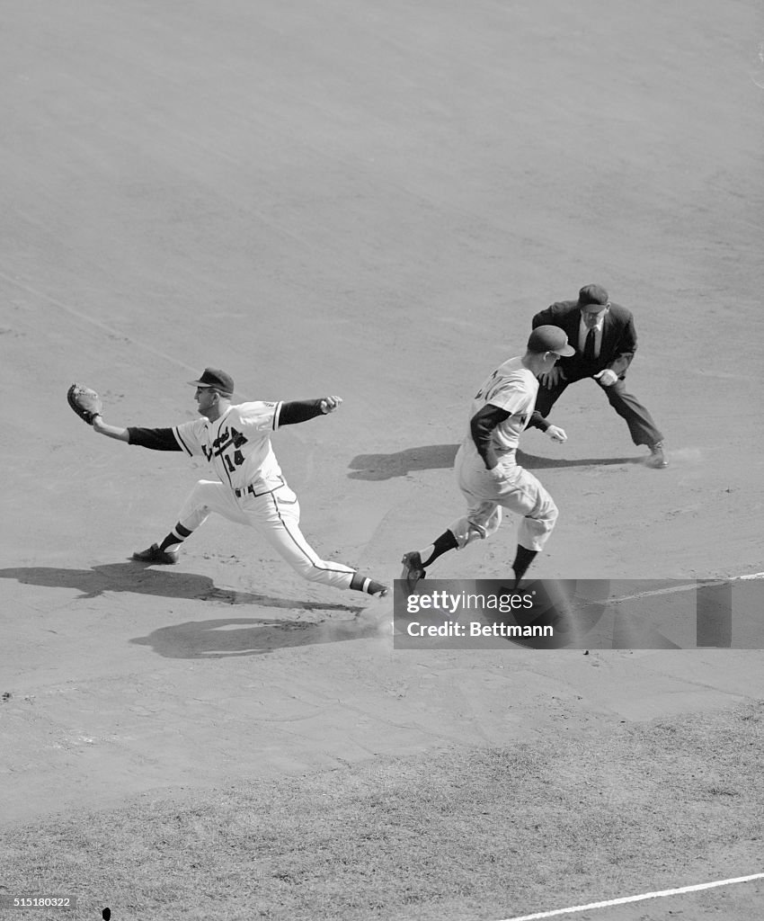 Baseball Player Crossing Base in Time