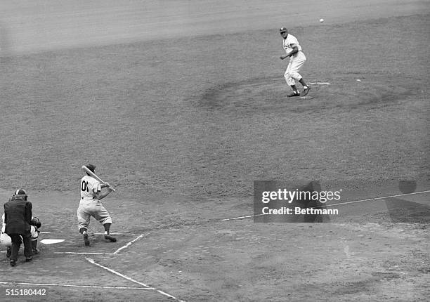 New York, NY: Yankee shortstop Phil "Scooter" Rizzuto singles in the first frame of the 4th World Series Game, Oct. 8, at Ebbets Field in Brooklyn,...