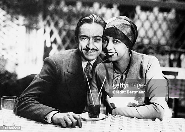 Famous singer and cabaret dancer Josephine Baker with her new husband, "Count" Pepito Abatino. They're shown at the Jardin des Acacias in Paris,...